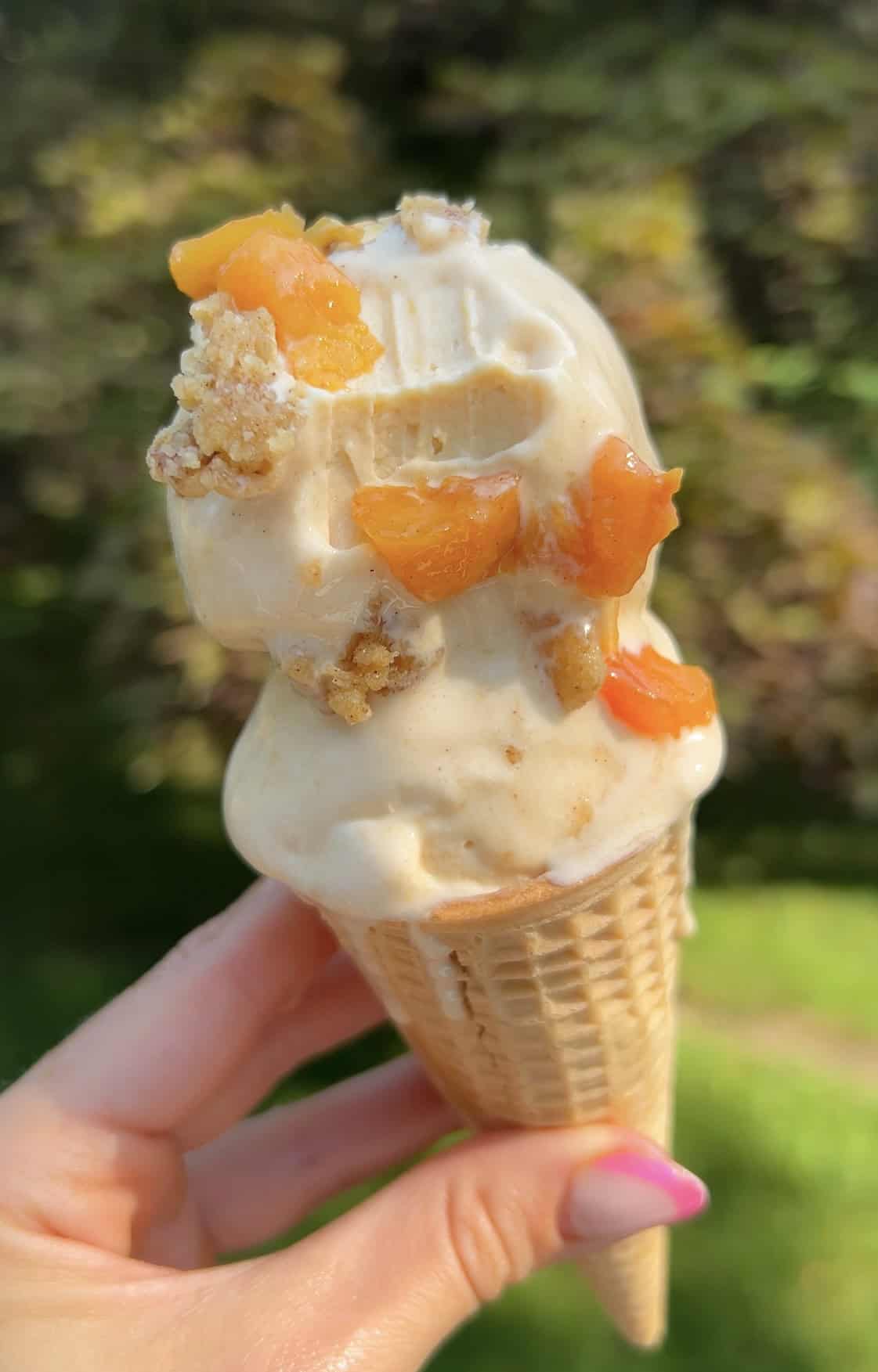 Peach cobbler Creami cone in summer light