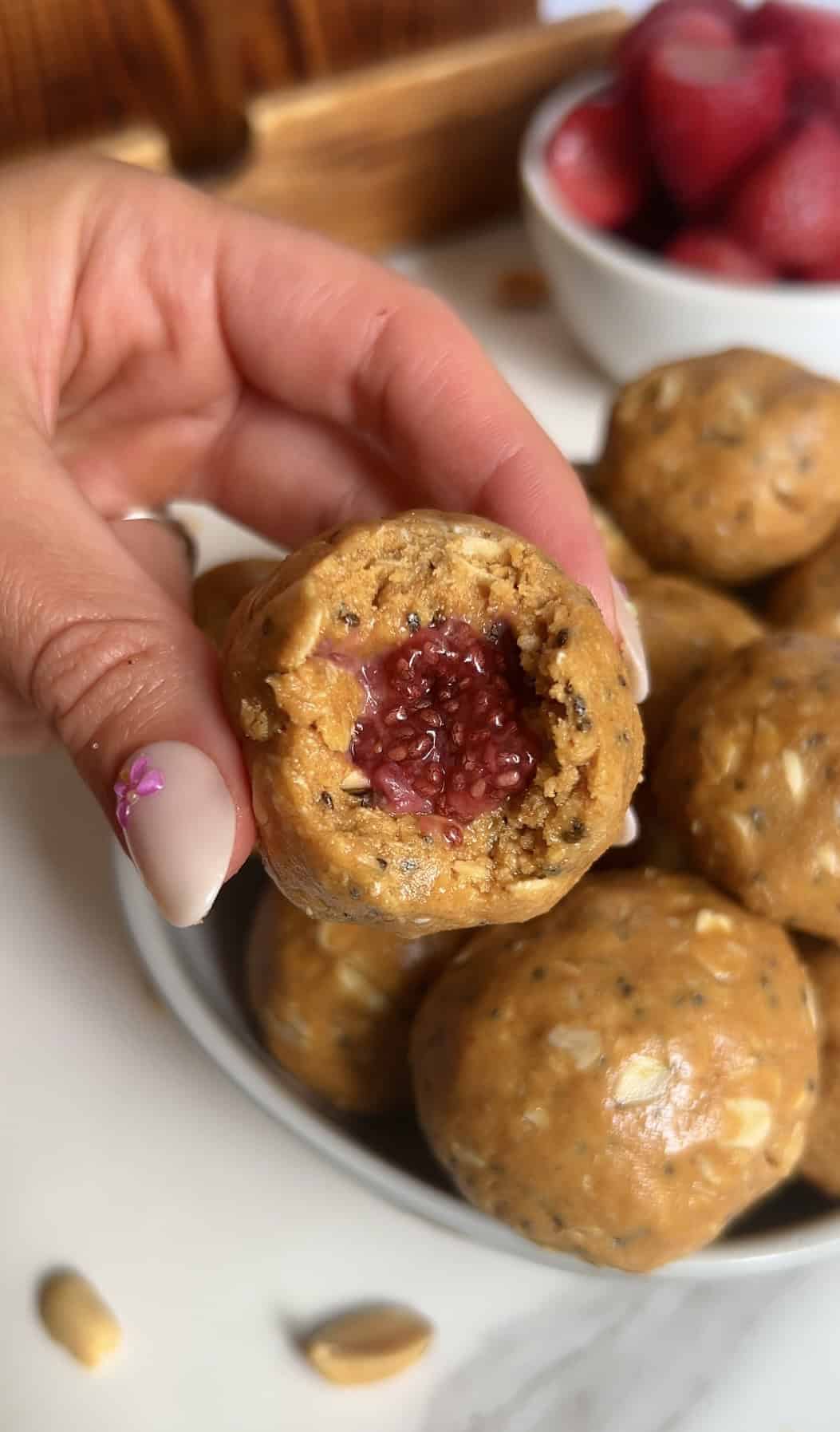 Inside shot of homemade strawberry chia jam inside peanut butter cookie dough ball