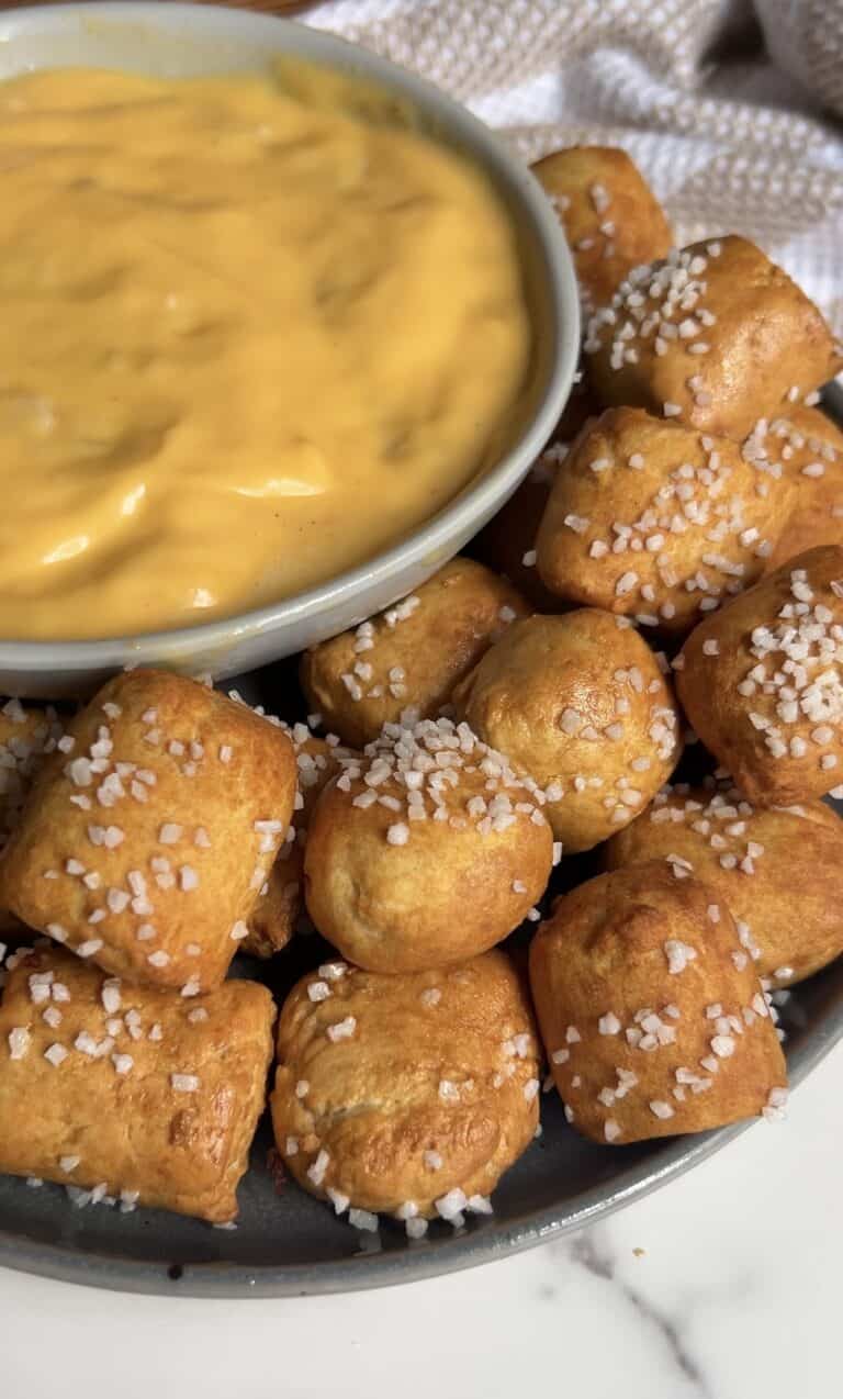 Golden pretzel nuggets with coarse salt served with cheese dip.