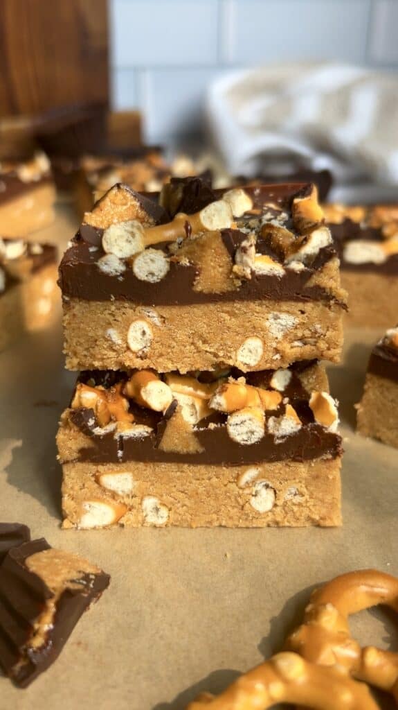 Stacked peanut butter pretzel protein bars showcasing crunchy pretzel details