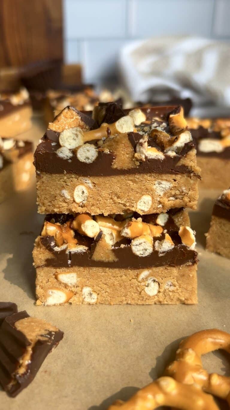 Stacked peanut butter pretzel protein bars showcasing crunchy pretzel details