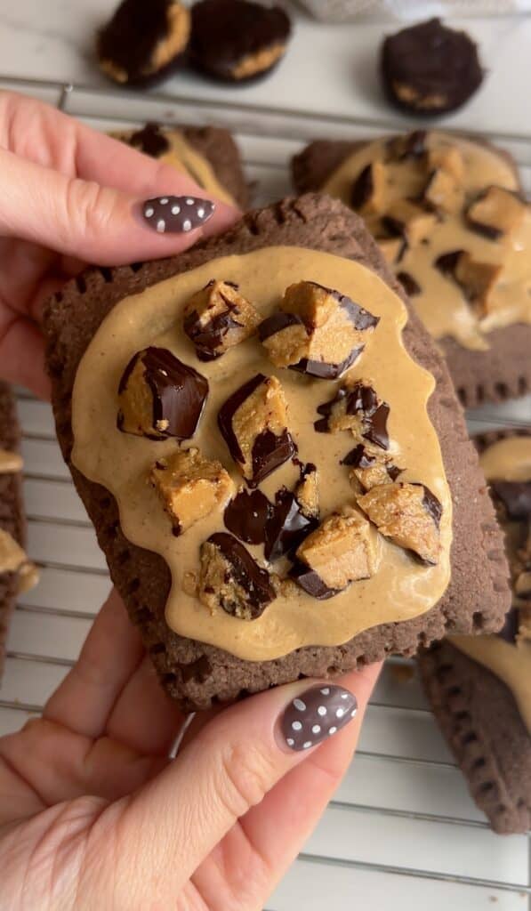 Chocolate and peanut butter gluten-free pop tart with chopped Reese's pieces.