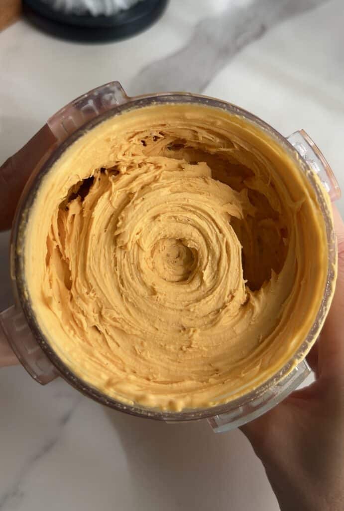 Cookies and cream ice cream in a ninja creami pint, super creamy, and ready to serve.